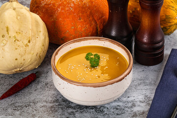 Vegan pumpkin cream soup served sesam
