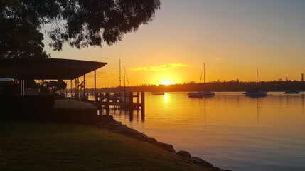 Obraz premium Golden sunrise illuminates the iconic , casting a serene glow over the calm waters.