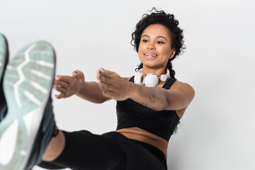 Strong female athlete performing an engaging fitness routine indoors for a healthier lifestyle