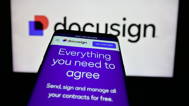 Stuttgart, Germany - 01-30-2025: Smartphone with website of US software company Docusign Inc. on screen in front of business logo. Focus on top-left of phone display.