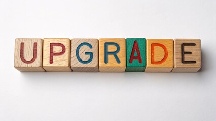 Obraz premium Alphabet wood blocks creatively arranged to spell upgrade symbolizing growth and progress in a business context showcasing the importance of continuous improvement and development.