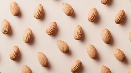 Almonds arranged in a minimalist style on a clean, white background, highlighting their smooth texture.