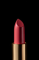 Close-up of red lipstick with shadow on black background. Modern make-up concept, fashion catalogue