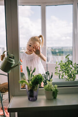 Elegant hand with colorful nails resting on a vibrant bouquet of roses