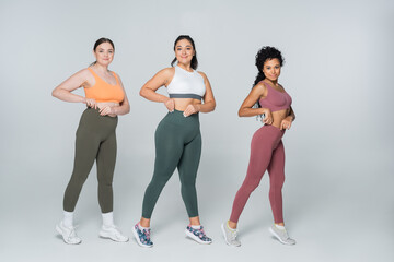 Obraz premium Embracing strength and beauty in fitness with a powerful trio of women