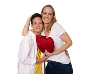 Young happy mother hugging her son holding a heart standing isolated over transparent background. PNG transparent.