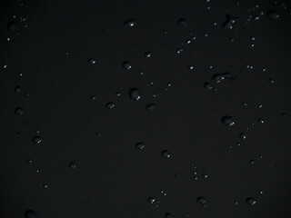 Water droplets on a dark surface. Overlay background wallpaper. Luxury Texture Design. Stylish fashion backdrop. 