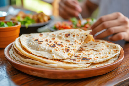 a satisfied customer at Paratha House Delhi, enjoying a delicious paratha and embodying the positive dining experience at the restaurant.