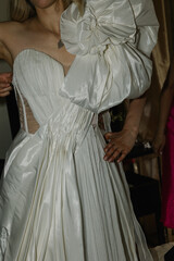 Fototapeta premium Elegant Wedding Dress with Statement Bow Detail