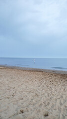 Bibione coastline stretching across sandy shore, merging turquoise waters with soft summer twilight...
