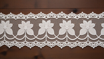 Elegant white lace border with floral motifs on rustic wooden background, timeless wedding decor
