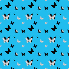 Flat illustration of black and white butterflies in a seamless pattern for a nature inspired design.