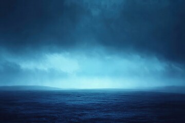 Serene Blue Ocean View Under Dramatic Cloudy Sky at Dusk