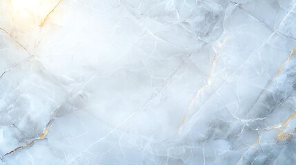 Obraz premium A beautiful and elegant marble background featuring soft white tones and subtle golden veining. Ideal for design projects needing a touch of luxury and sophistication.