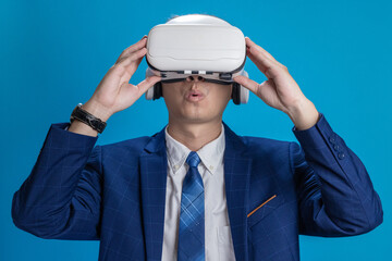 Businessman in VR headset controls virtual reality AI program to give instructions