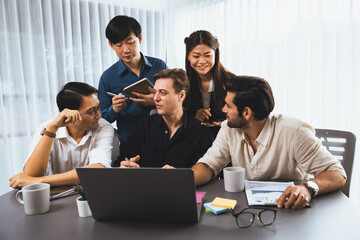 Obraz premium Group of diverse office worker employee working together on strategic business marketing planning in corporate office room. Positive teamwork in business workplace concept. Prudent