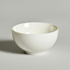 Simple white bowl on a minimalistic surface.