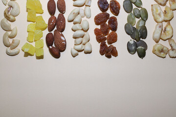 mix of nuts and dried fruits. healthy food. raisins, pumpkin seeds, dried pineapple and banana, peanuts, almonds, cashews