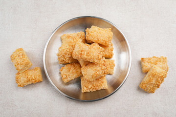 Crunchy pastry cookies with almond sprinkles 
