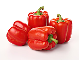 Four vibrant red bell peppers on white background