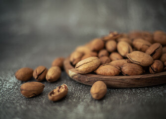 pecans in their shells on the table