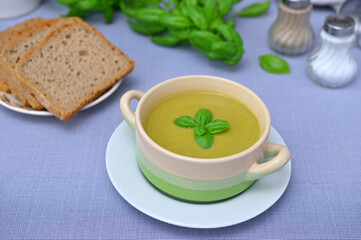 diet broccoli puree soup in a bowl close-up