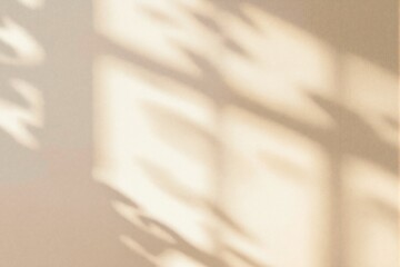 Abstract soft light and shadow pattern on beige background.
