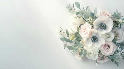 bride is holding a bouquet with anemones and greenery