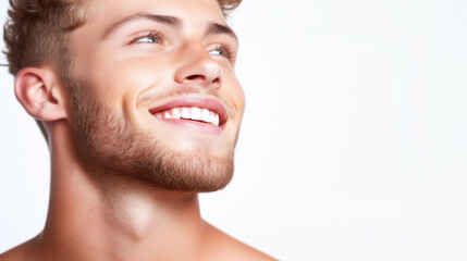 Obraz premium Joyful young man smiling studio portrait photography bright upbeat