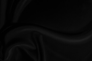 Black gray satin dark fabric texture luxurious shiny that is abstract silk cloth background with patterns soft waves blur beautiful.