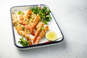 Shrimp skewers with quinoa and leaf salad