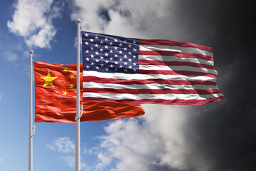 Flags of China and US above dark sky.