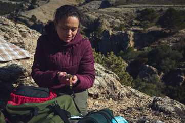 Person calmly holding a small bird outdoors