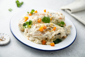 Rabbit with sour cream sauce and vegetables