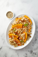 Pumpkin with quinoa and pine nuts