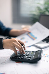 Finance bank tax expense accounting budget money businessman hand use calculator Financial...