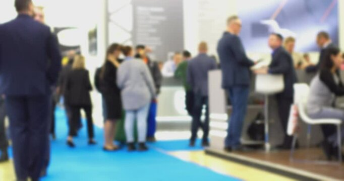 Businessman walking through busy conference hall