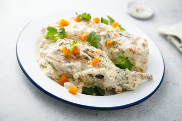Rabbit with sour cream sauce and vegetables
