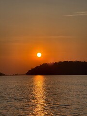 Naklejka premium sunset over the river