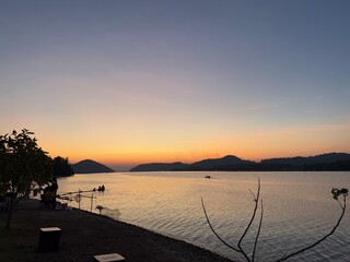 the most beautiful sunset on the lake © Poovadon