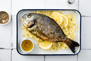 Baked dorado with lemon and couscous