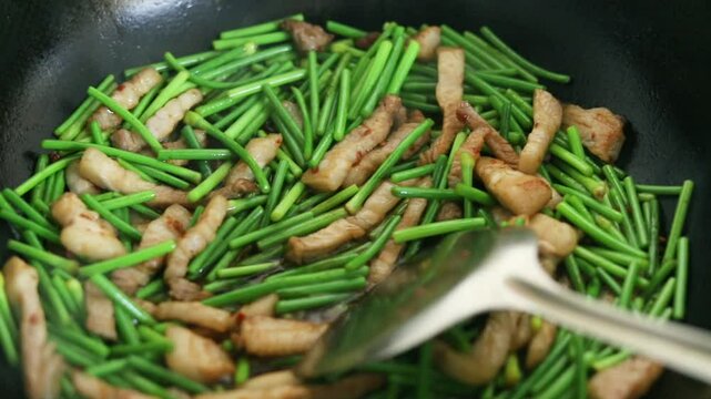 Stir-fried meat with garlic moss
