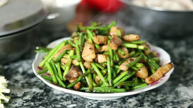 Stir-fried meat with garlic moss