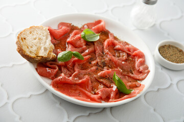 Traditional beef carpaccio with truffle oil