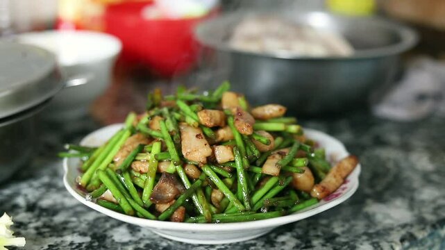 Stir-fried meat with garlic moss