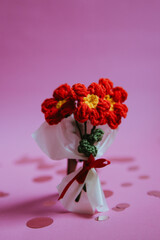A bouquet of red knitted flowers on a beautiful background, a bouquet of red flowers, knitted flowers, knitted bouquets, handmade, knitted flowers, knitted gifts and toys
