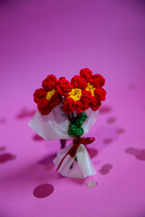 A bouquet of red knitted flowers on a beautiful background, a bouquet of red flowers, knitted flowers, knitted bouquets, handmade, knitted flowers, knitted gifts and toys