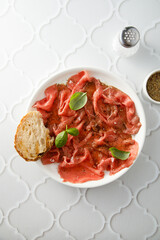 Traditional beef carpaccio with truffle oil