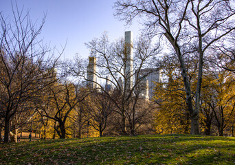 Fototapeta premium Central Park Autumn landscape, looking south to midtown Manhattan, with skyscrapers and office towers in the background.