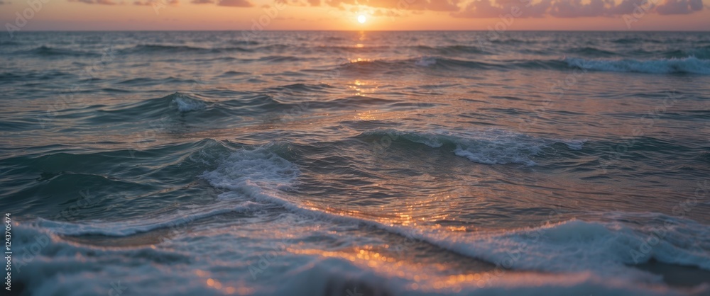 Poster texture of the atlantic ocean at sunset with gentle waves and shimmering light creating a serene and